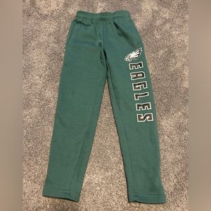 Eagles sweatpants. Warm fleece inside. Never worn. Size is listed as medium 8